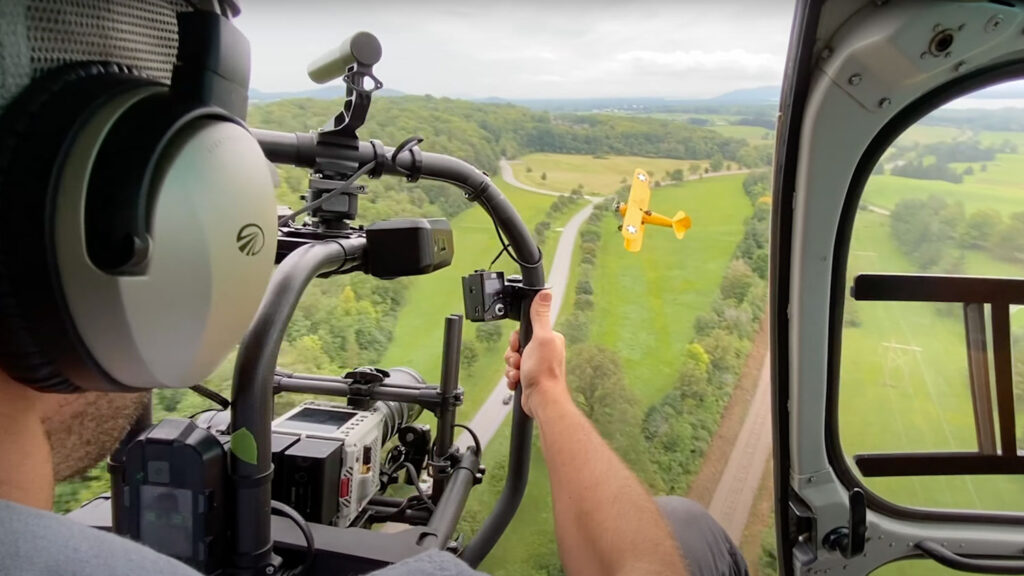 An image showing the view out of a plane behind a camera rig